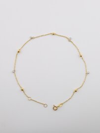 Zlatý náramok s guľôčkou a kamienkom v bielom zlate