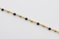 Elegantný náramok  so žltými a čiernymi guľôčkami