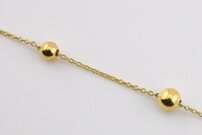 Zlatý náramok guľôčky